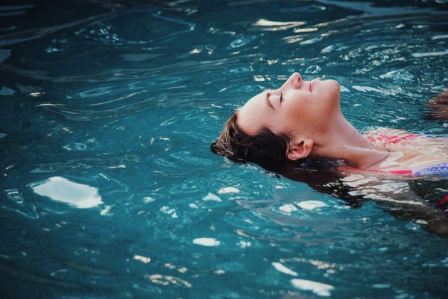 Woman relaxing as she swims